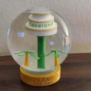 Lakeland, FL Snow globe with cake tower and swan. Makes a great gift and a perfect collectible for anyone who likes Lakeland