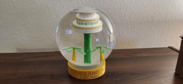 Lakeland, FL Snow globe with cake tower and swan. Makes a great gift and a perfect collectible for anyone who likes Lakeland