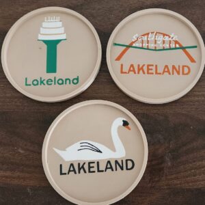 This set of 3 Lakeland, FL drink coasters features the icons of Lakeland including a swan, the Southgate arch and the birthday cake water tower.