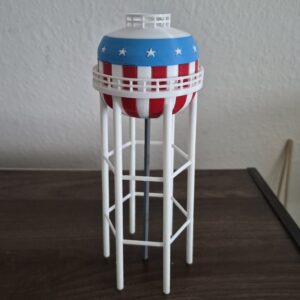3D printed Spring Lake Park Minnesota water tower replica with patriotic red white and blue striped design and white stars