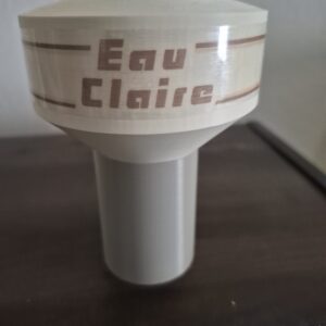 3D printed miniature replica of the Folsom water tower in Eau Claire, Wisconsin, featuring a short cylindrical tank with "Eau Claire" lettering and horizontal accent bands, displayed on a tabletop.