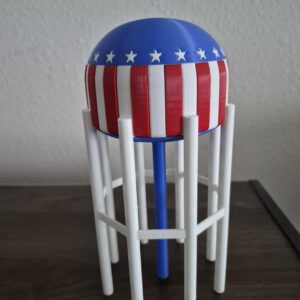 Sticker-free 3D printed replica of the patriotic Bowling Green, Kentucky water tower with blue top, white stars, and red and white stripes.